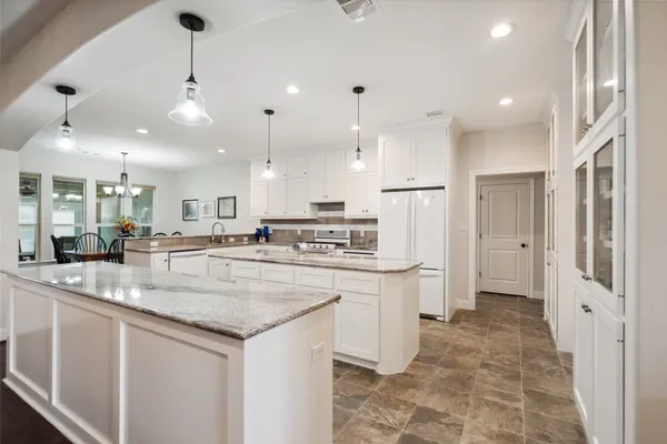 a bedroom with a bed and a flat tv screen on wall
