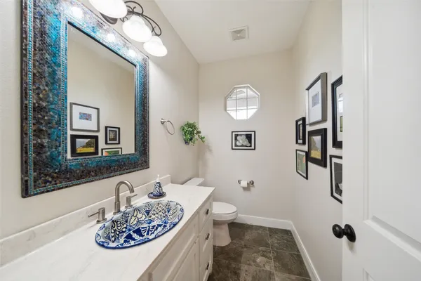 a view of a patio with table and chairs with wooden floor and fence