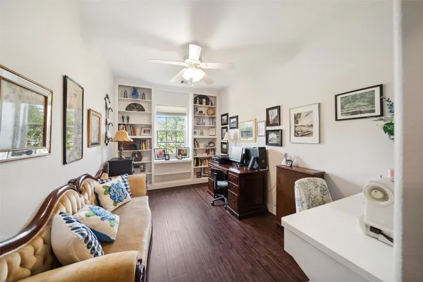 a view of a house with a backyard