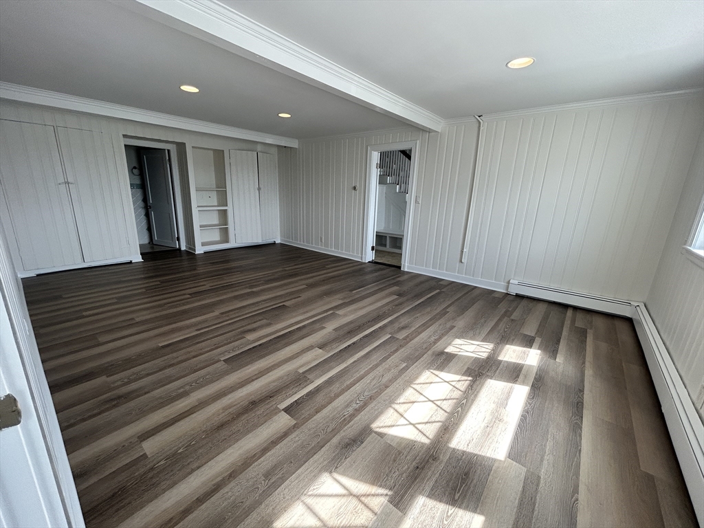 75 Surfside Road Scituate, MA 02066 - Photo 23 of 25 a view of empty room with wooden floor