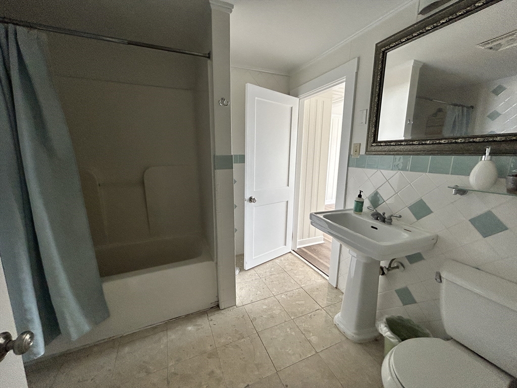 75 Surfside Road Scituate, MA 02066 - Photo 25 of 25 a bathroom with a sink toilet and shower