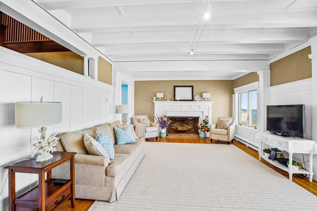75 Surfside Road Scituate, MA 02066 - Photo 7 of 25 a living room with furniture and a flat screen tv