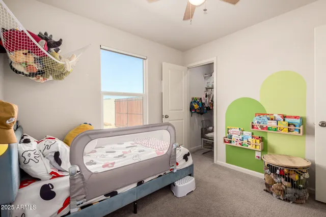 a bedroom with bed and a window