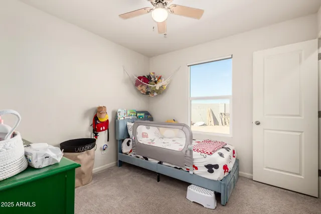 a bedroom with furniture and a chandelier