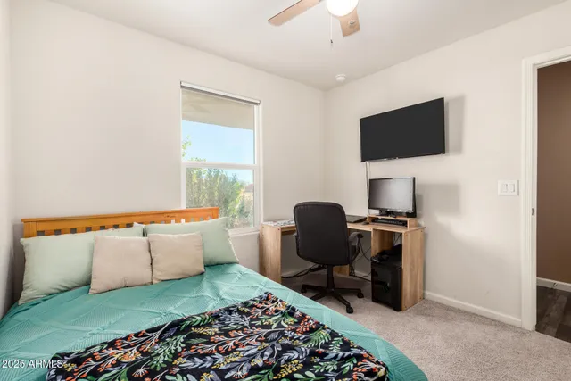 a view of workspace with wooden floor windows