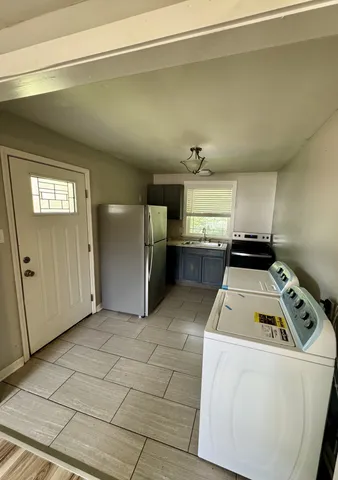 a utility room with washer and dryer