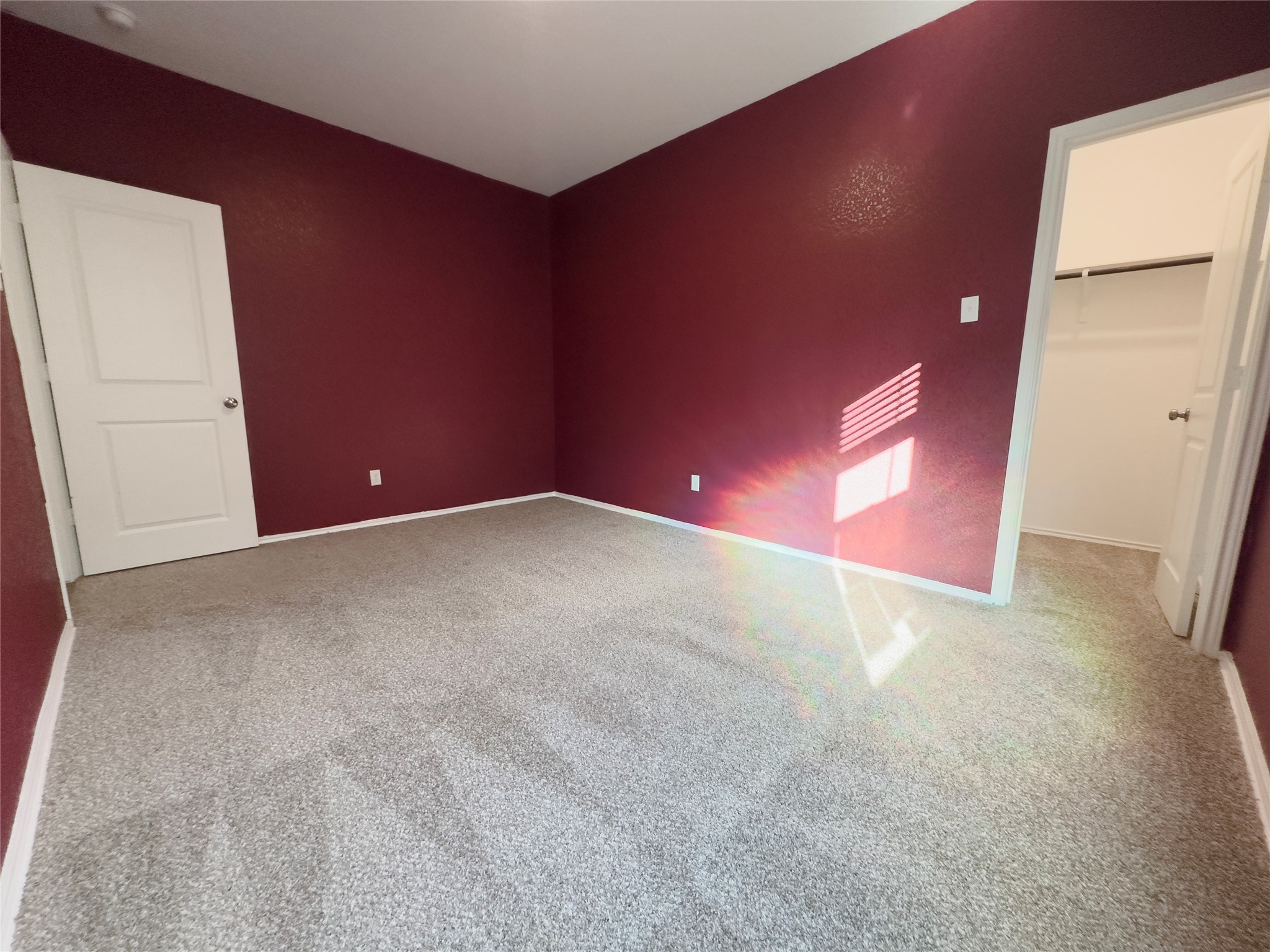 312 Soapstone Pass Maxwell, TX 78656 - Photo 13 of 21 Spacious room featuring plush grey carpeting and rich burgundy walls