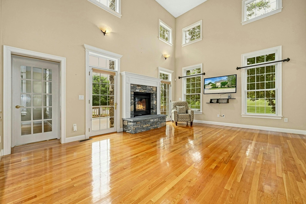 47 Clubhouse Way, Unit 47 Sutton, MA 01590 - Photo 12 of 30 a view of a livingroom with a fireplace and window