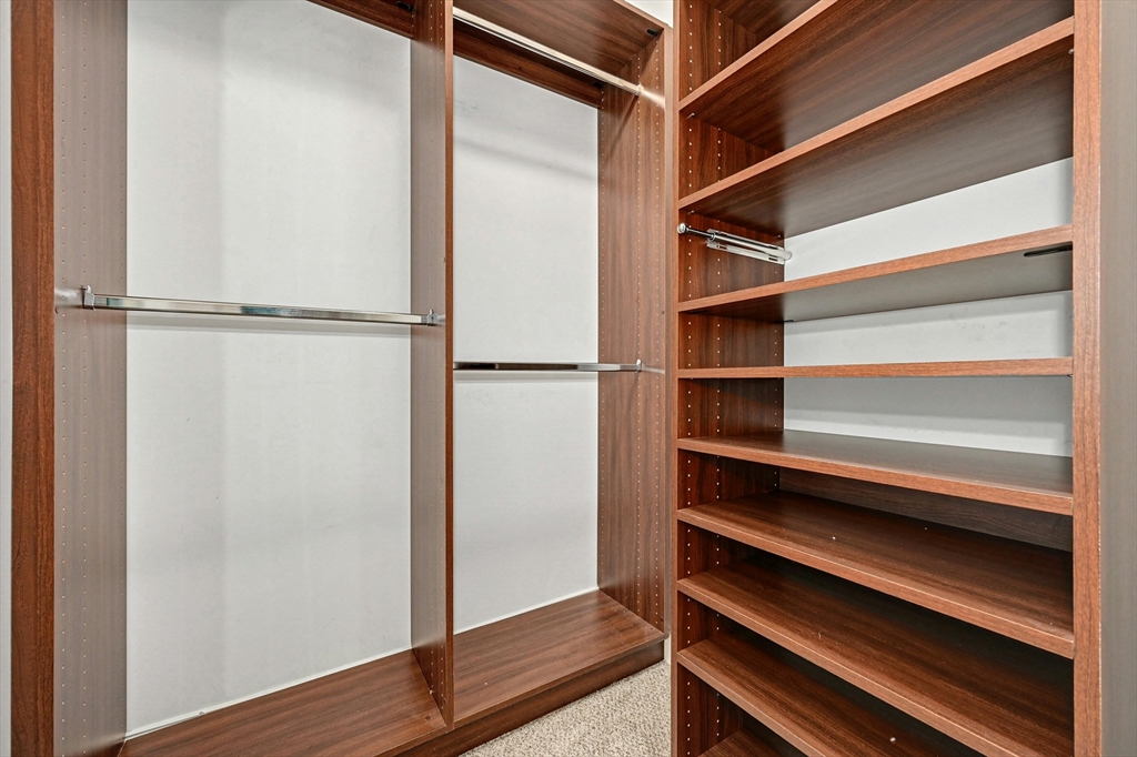 47 Clubhouse Way, Unit 47 Sutton, MA 01590 - Photo 15 of 30 a view of walk in closet with empty racks
