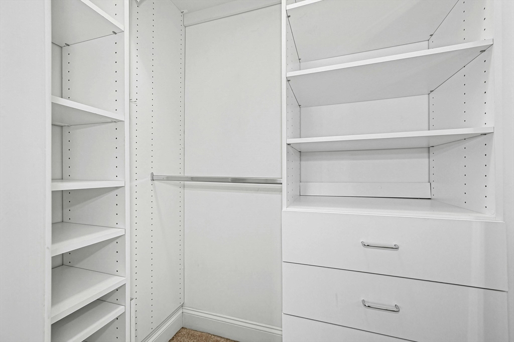 47 Clubhouse Way, Unit 47 Sutton, MA 01590 - Photo 19 of 30 a view of walk in closet with empty racks