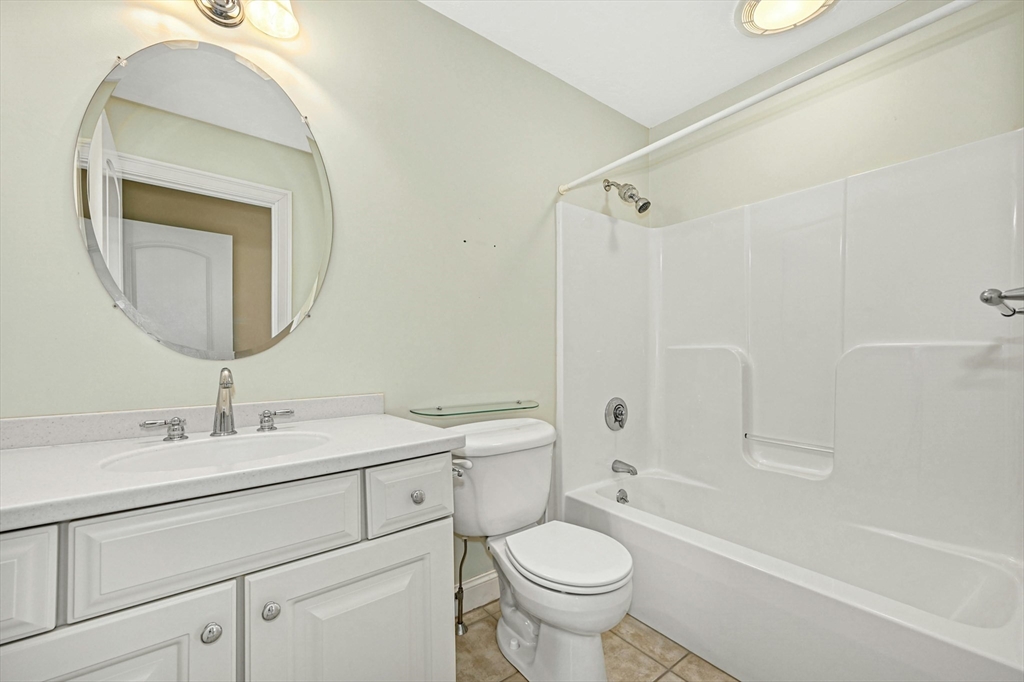 47 Clubhouse Way, Unit 47 Sutton, MA 01590 - Photo 20 of 30 a bathroom with a toilet sink and mirror