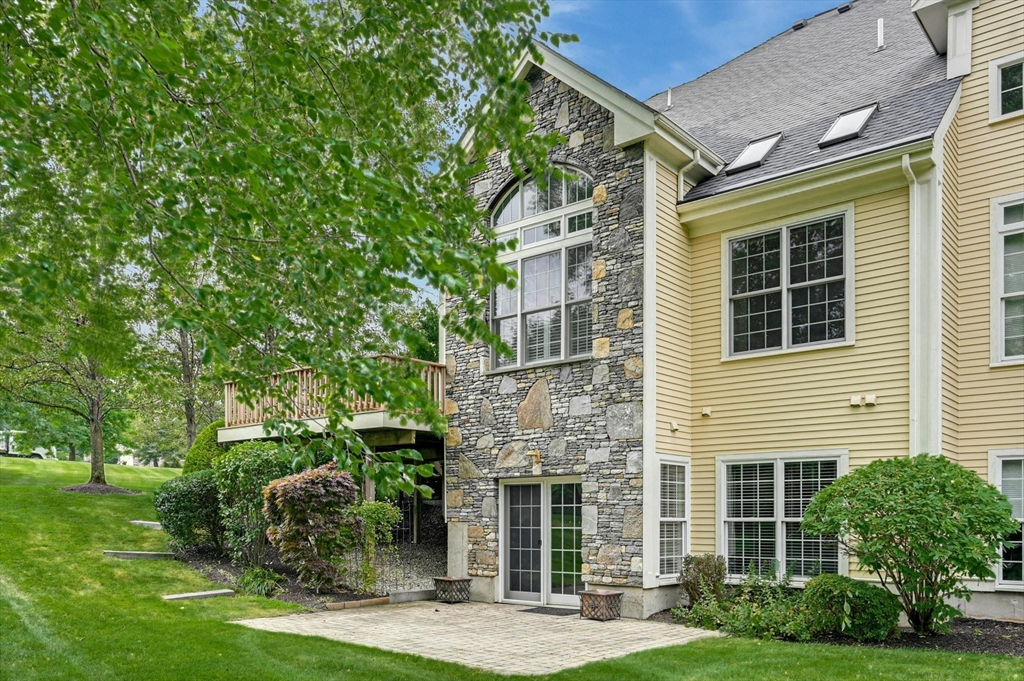 47 Clubhouse Way, Unit 47 Sutton, MA 01590 - Photo 24 of 30 a front view of a house with a yard
