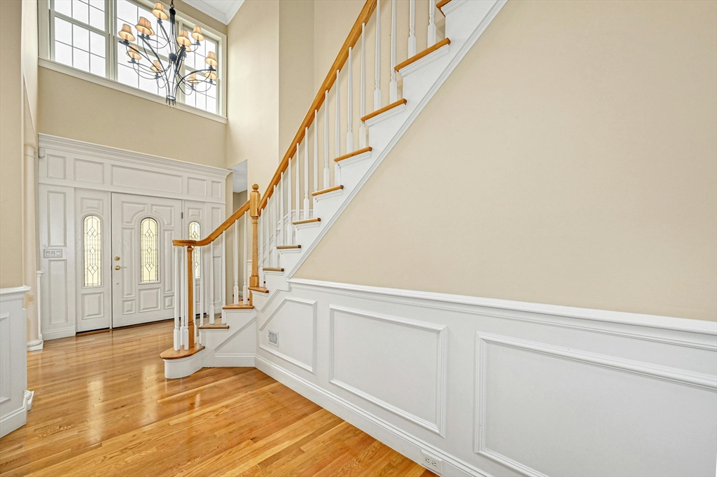 47 Clubhouse Way, Unit 47 Sutton, MA 01590 - Photo 4 of 30 a view of staircase with white walls and railing