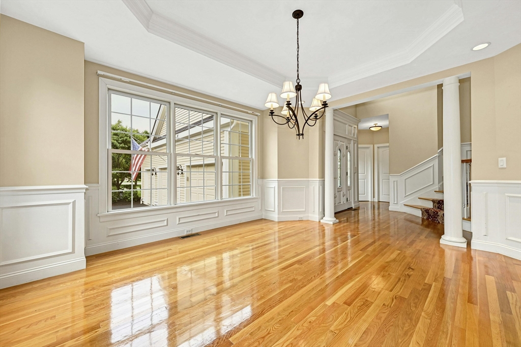 47 Clubhouse Way, Unit 47 Sutton, MA 01590 - Photo 5 of 30 a view of empty room with wooden floor and fan