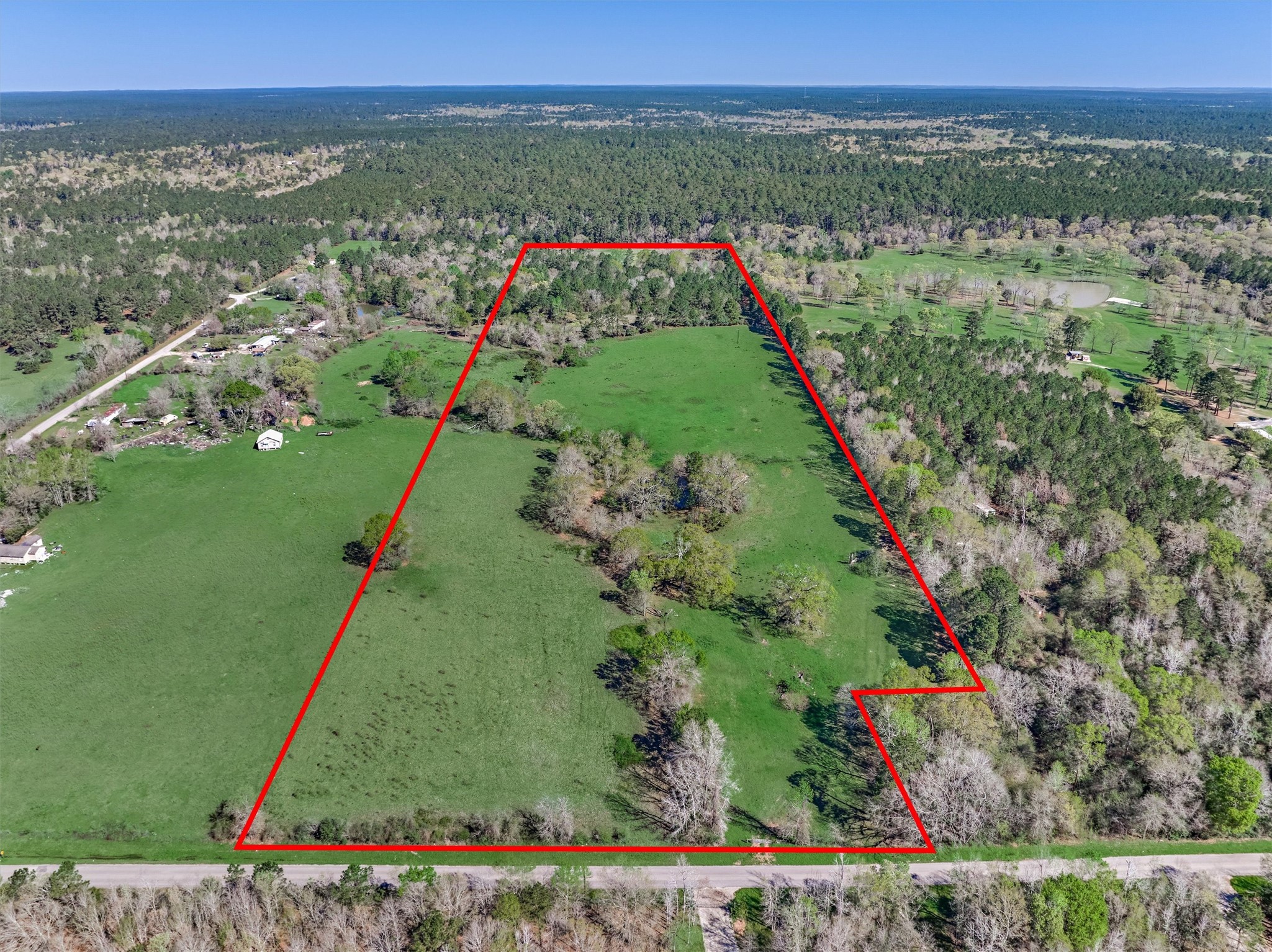 Tbd Bailey Grove Road Montgomery, TX 77356 - Photo 3 of 17 a view of a lush green field with a view of nearby houses