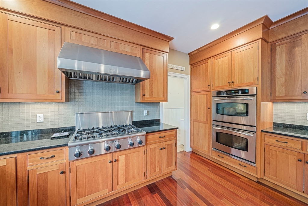 6 Northey Farm Road Scituate, MA 02066 - Photo 11 of 40 a kitchen with stainless steel appliances granite countertop a stove sink and cabinets