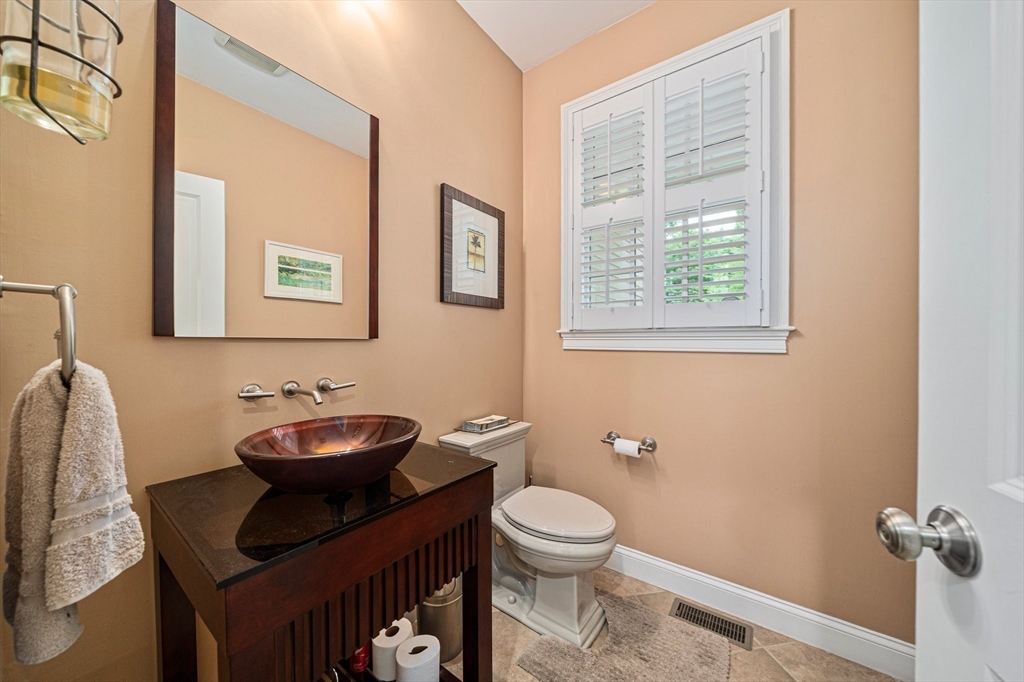 6 Northey Farm Road Scituate, MA 02066 - Photo 20 of 40 a bathroom with a toilet sink and mirror