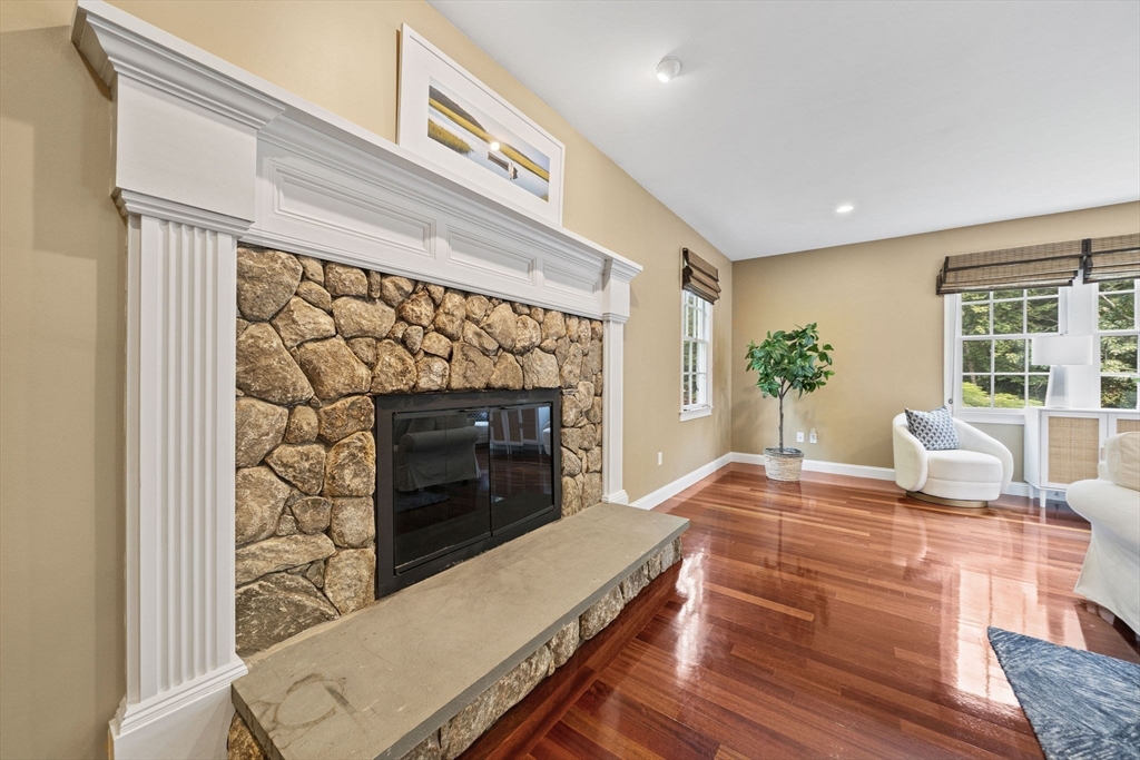 6 Northey Farm Road Scituate, MA 02066 - Photo 8 of 40 a living room with furniture a fireplace and a potted plant