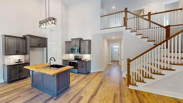 a kitchen with wooden cabinets and stainless steel appliances
