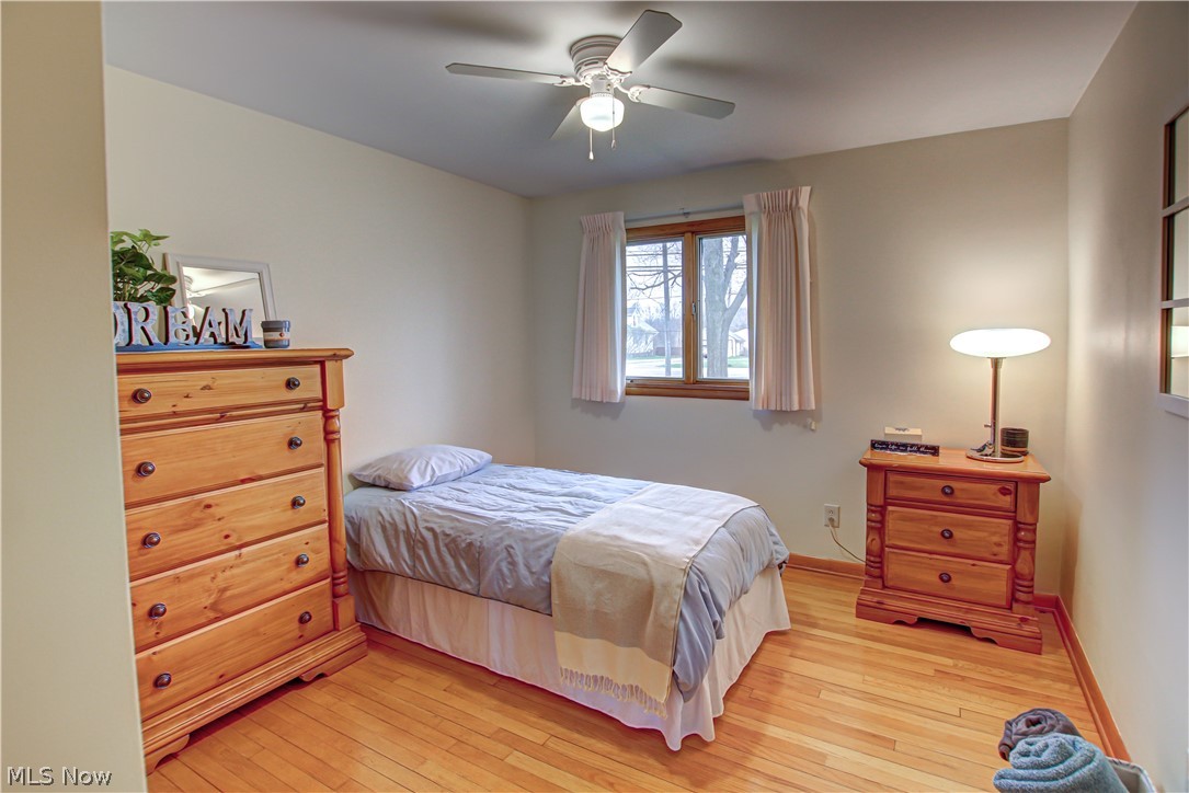 39974 Butternut Ridge Road Elyria, OH 44035 - Photo 15 of 40 Bedroom featuring light wood-type flooring and ceiling fan