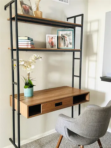 a living room with table and furniture