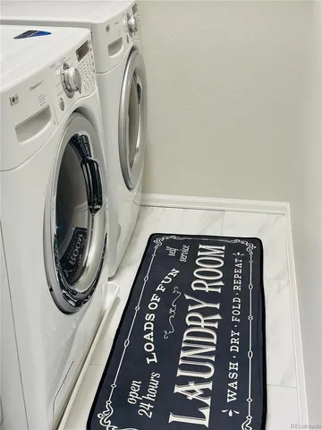 a utility room with dryer and washer