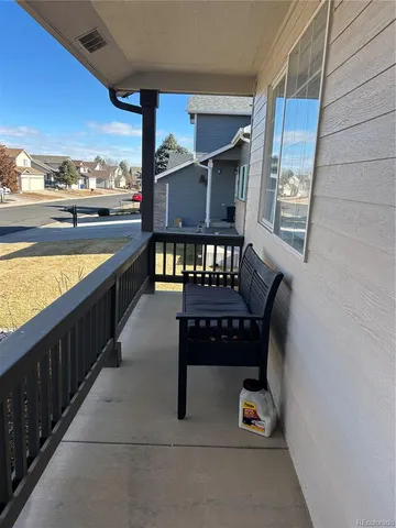 a view of balcony with wooden floor