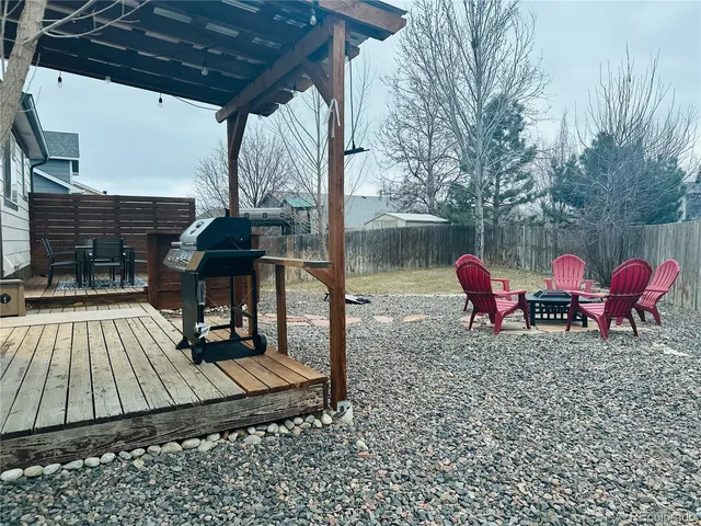 a view of a roof deck with patio