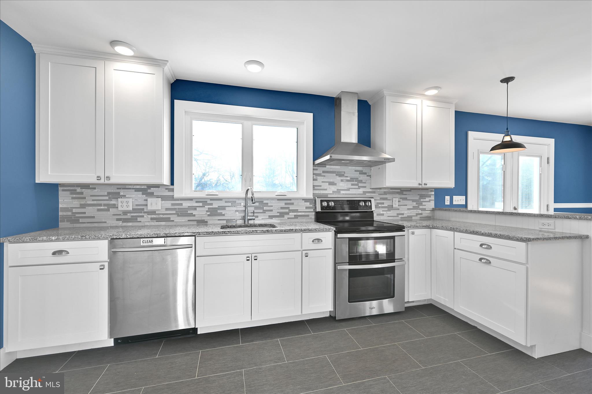 104 Locust Street Annville, PA 17003 - Photo 13 of 43 a kitchen with stainless steel appliances granite countertop a stove sink and cabinets