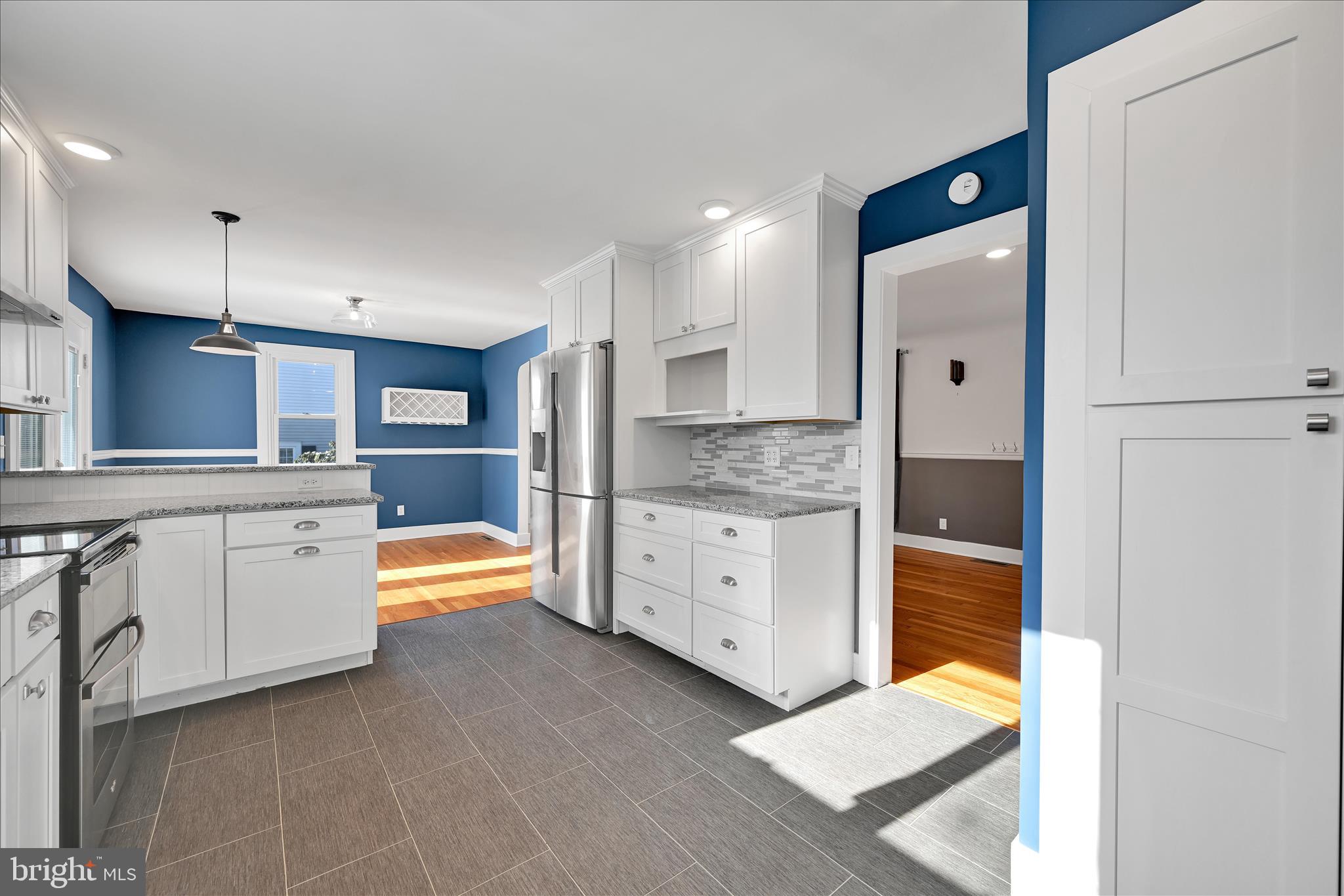 104 Locust Street Annville, PA 17003 - Photo 15 of 43 a large white kitchen with stainless steel appliances granite countertop a refrigerator and a stove