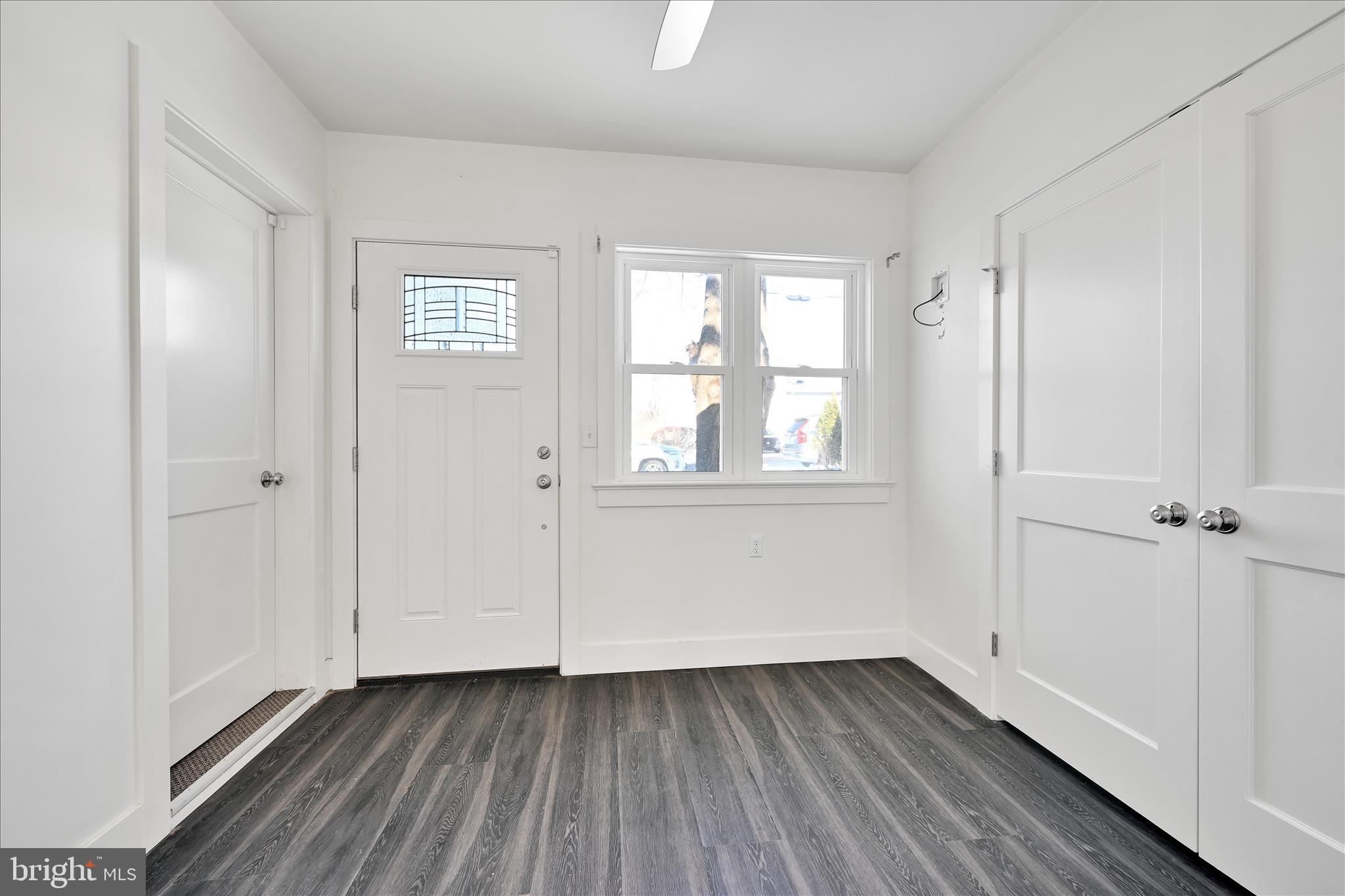 104 Locust Street Annville, PA 17003 - Photo 18 of 43 a view of an empty room with wooden floor and a window