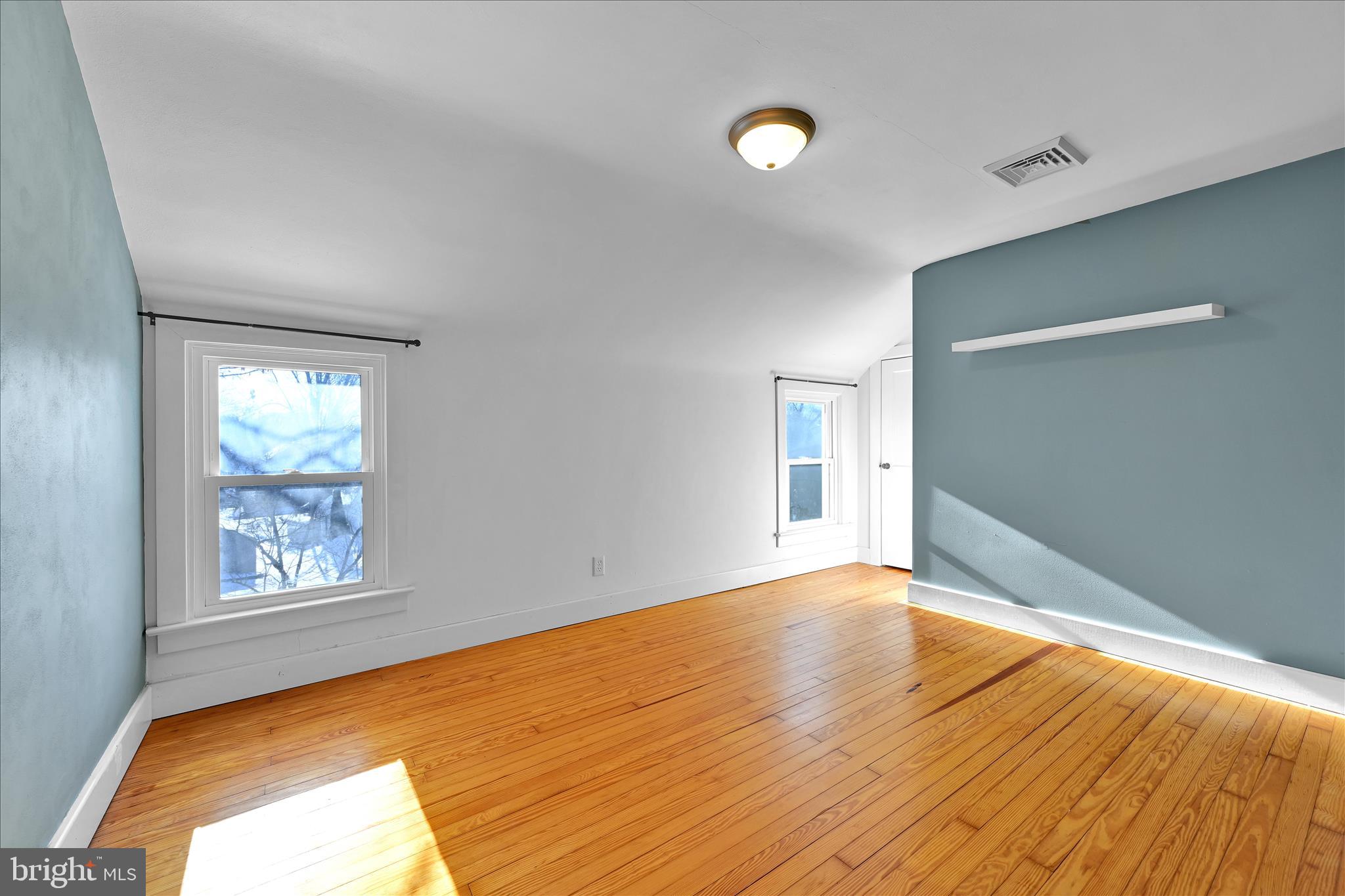 104 Locust Street Annville, PA 17003 - Photo 24 of 43 a view of empty room with wooden floor and fan