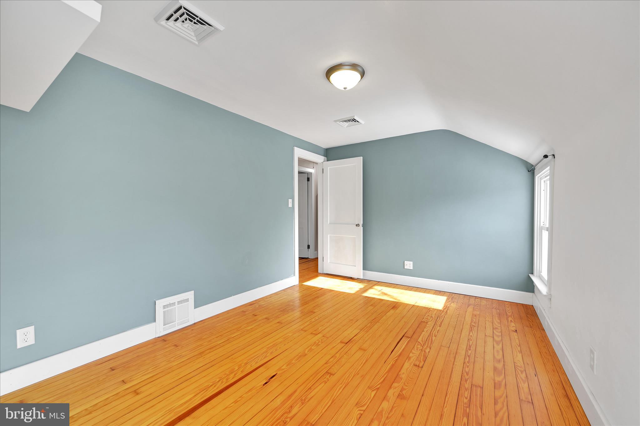 104 Locust Street Annville, PA 17003 - Photo 25 of 43 a view of an empty room with wooden floor