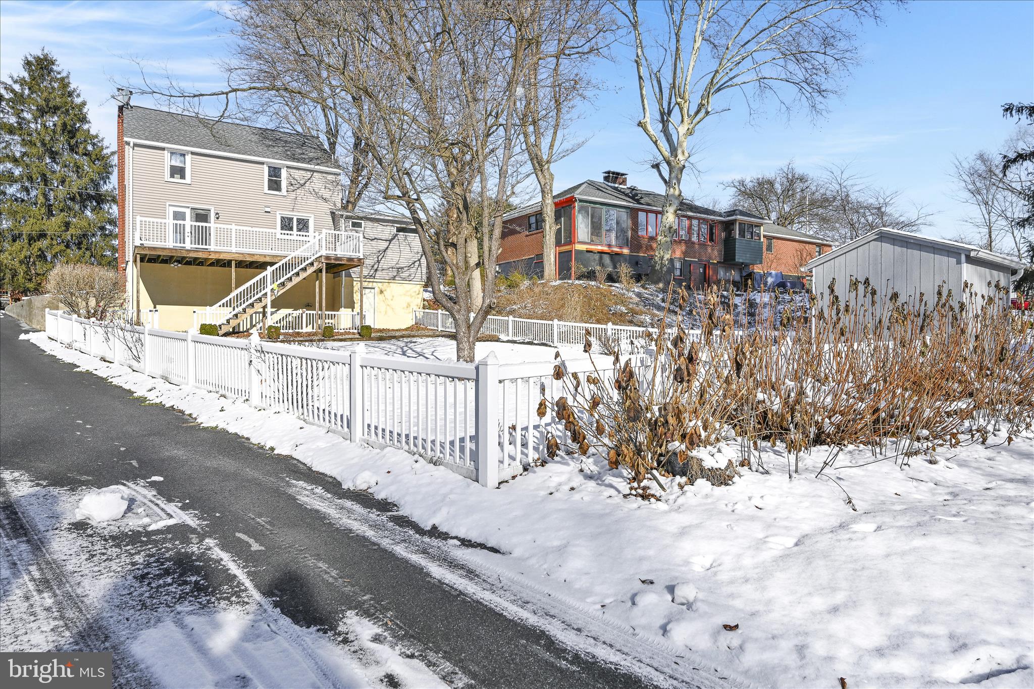 104 Locust Street Annville, PA 17003 - Photo 26 of 43 a front view of a house with a yard covered with snow