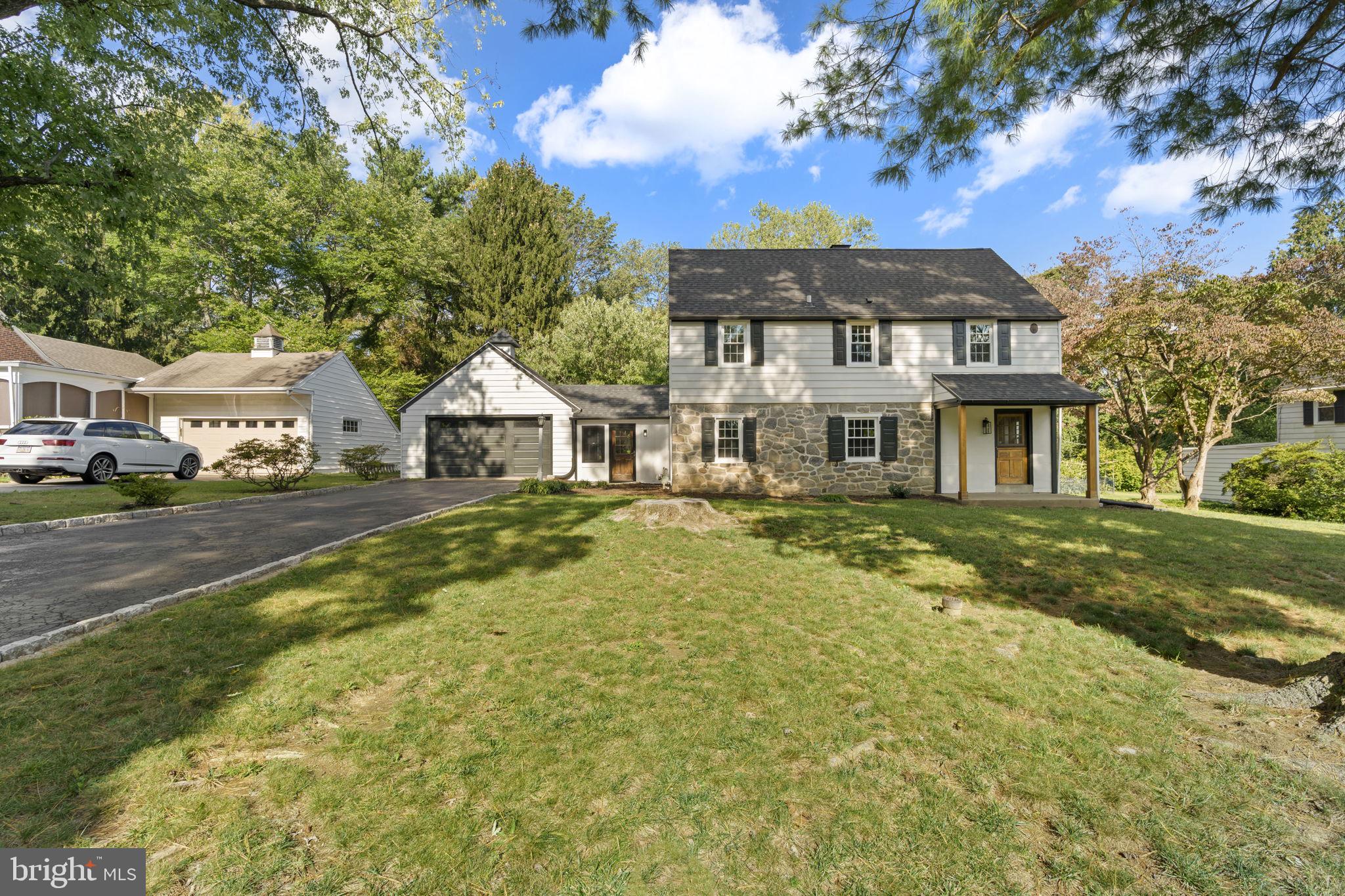 218 Engle Drive Wallingford, PA 19086 - Photo 1 of 51 a front view of a house with a yard