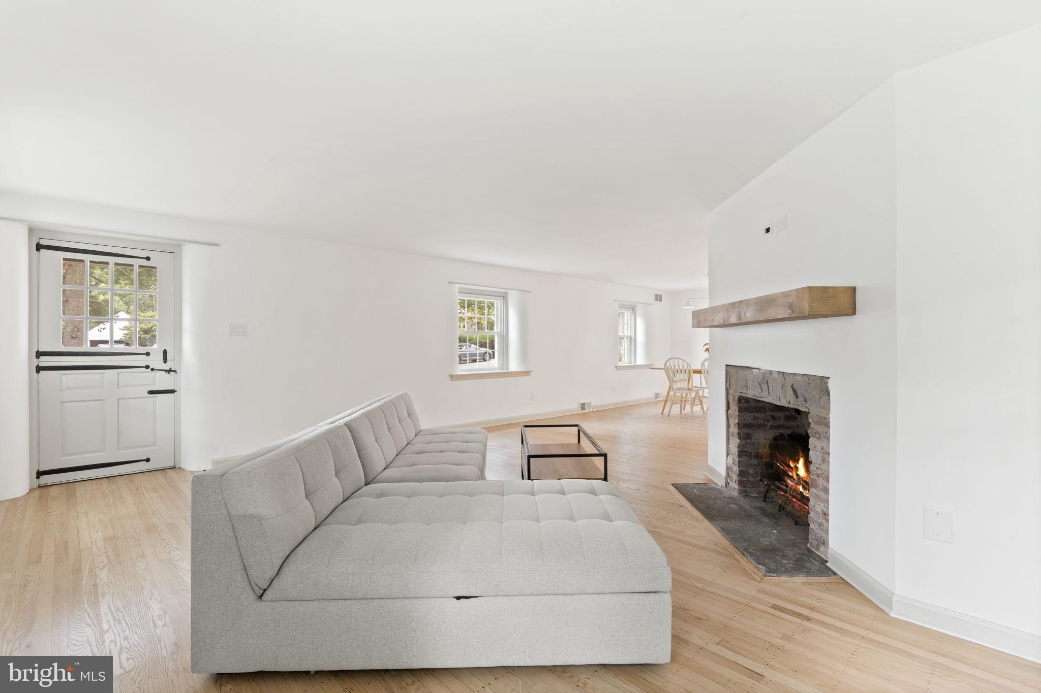 218 Engle Drive Wallingford, PA 19086 - Photo 12 of 51 a living room with furniture and a fireplace