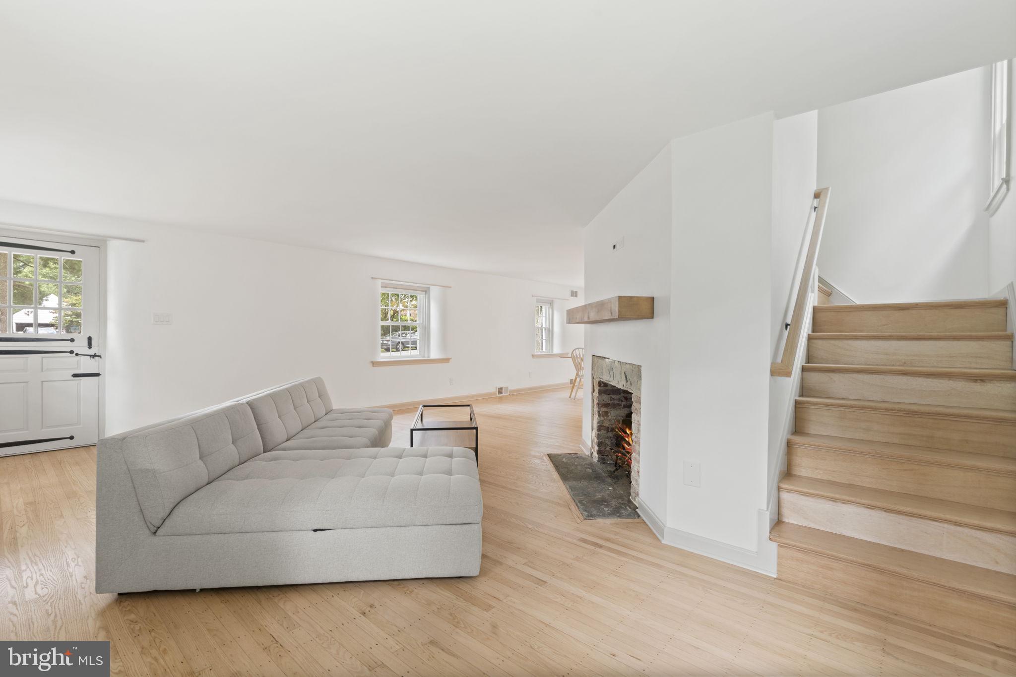 218 Engle Drive Wallingford, PA 19086 - Photo 13 of 51 a living room with furniture and a wooden floor