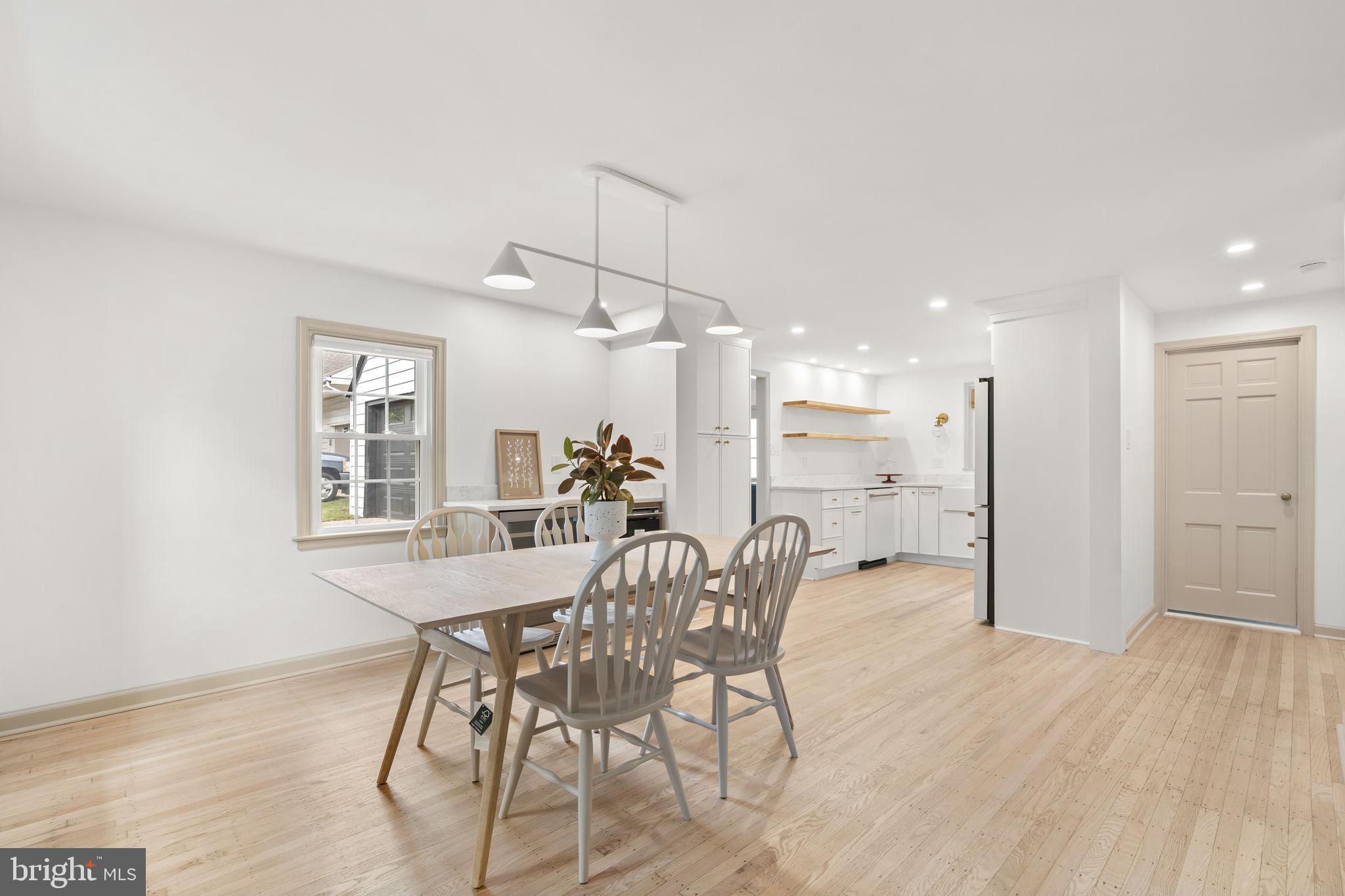 218 Engle Drive Wallingford, PA 19086 - Photo 14 of 51 a view of a dining room with furniture and wooden floor