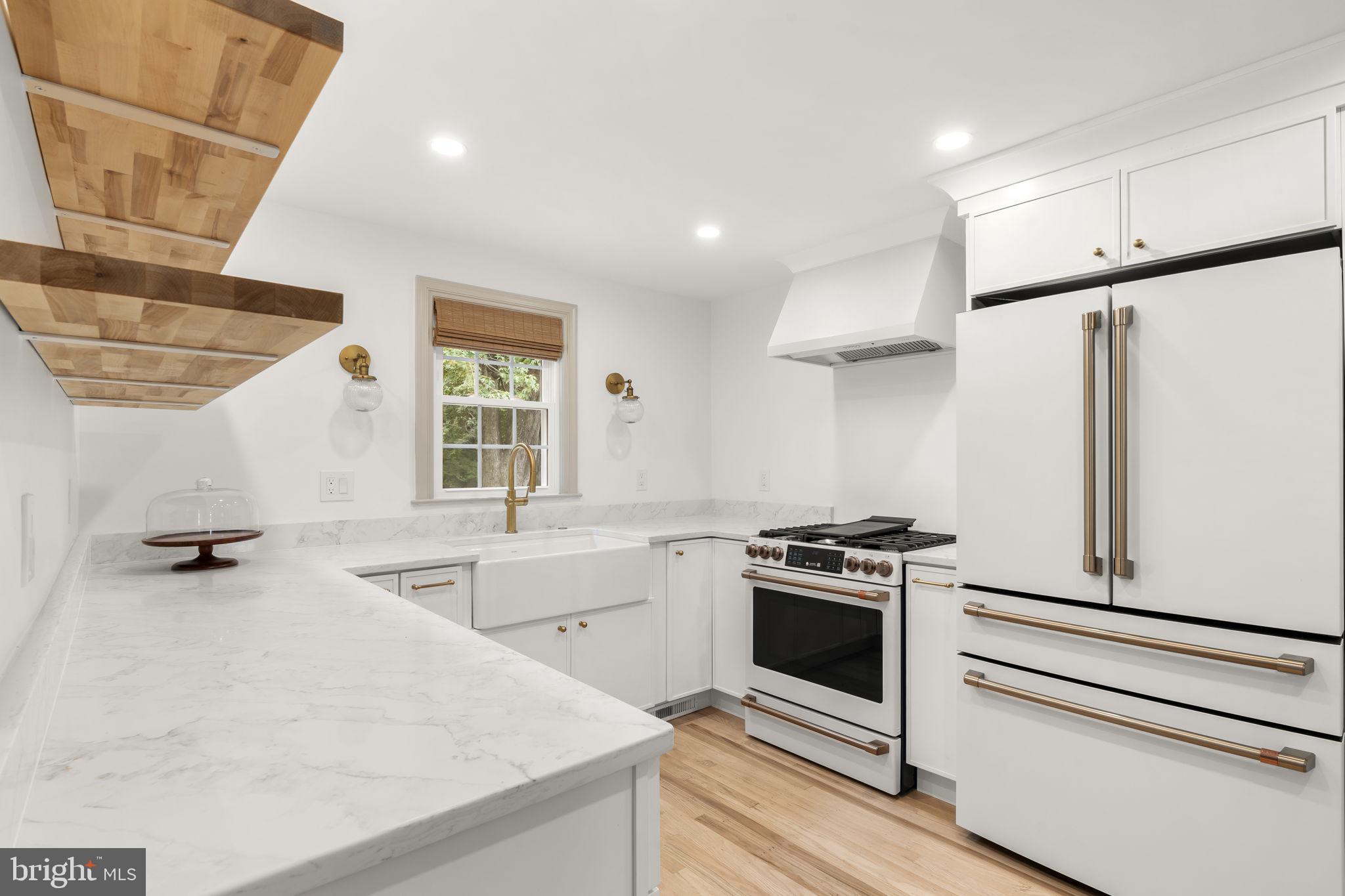 218 Engle Drive Wallingford, PA 19086 - Photo 19 of 51 a kitchen with a sink stove and refrigerator