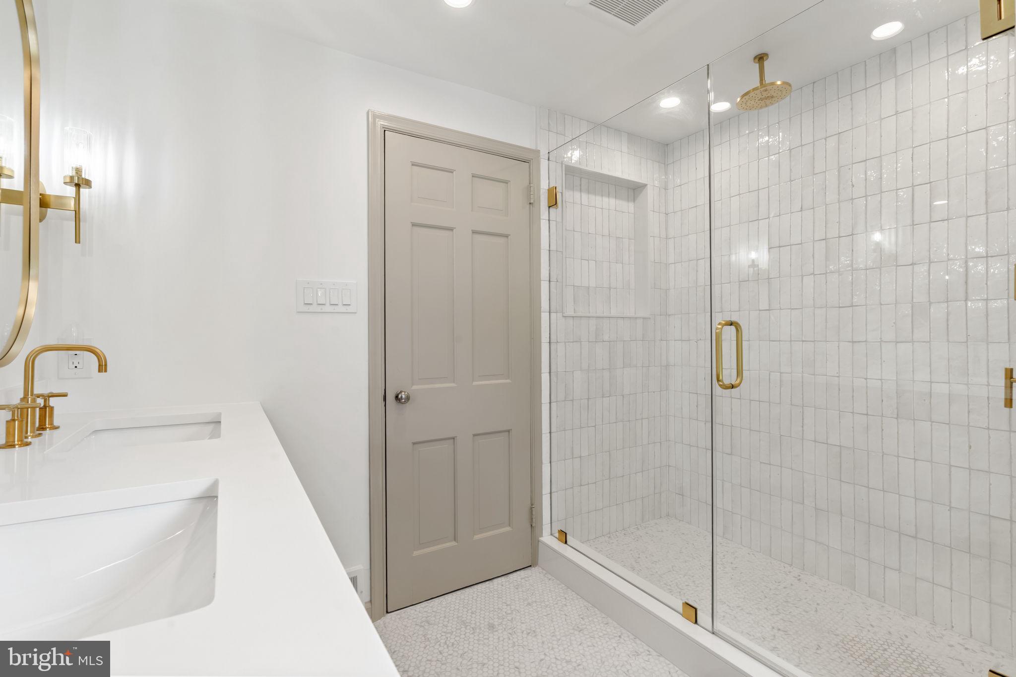 218 Engle Drive Wallingford, PA 19086 - Photo 37 of 51 a bathroom with a shower a toilet and sink