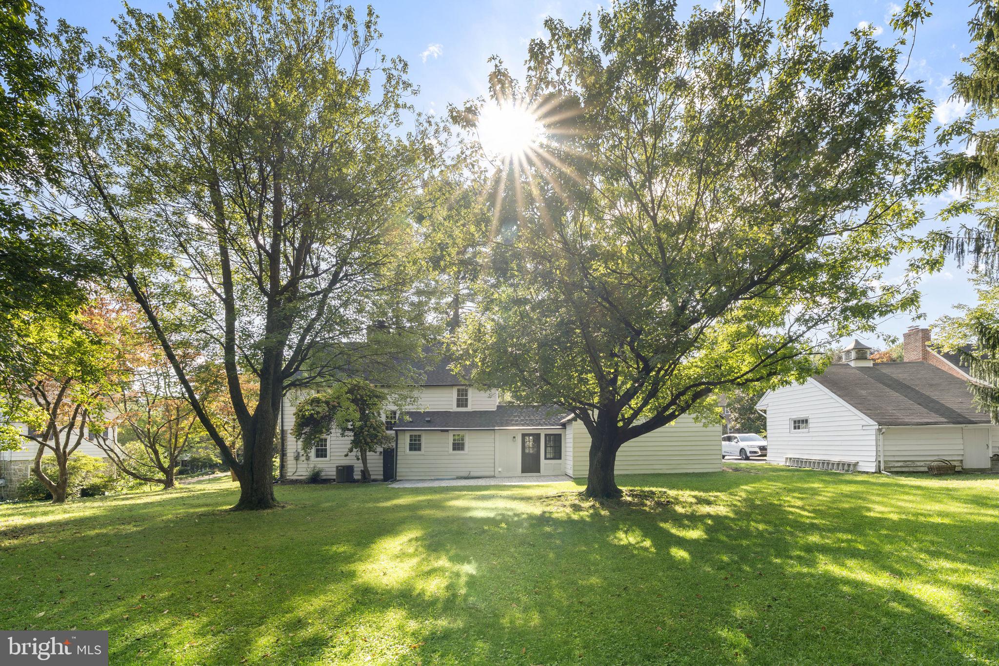 218 Engle Drive Wallingford, PA 19086 - Photo 47 of 51 a front view of house with yard and trees