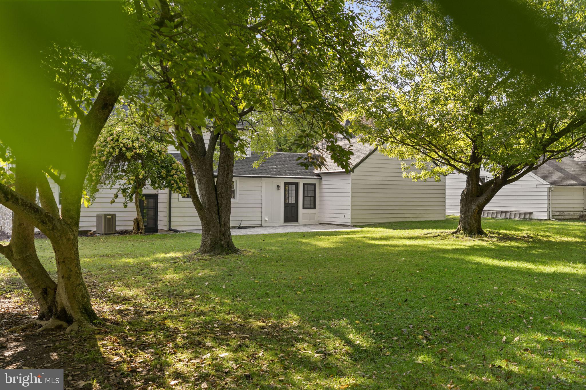 218 Engle Drive Wallingford, PA 19086 - Photo 48 of 51 a front view of a house with a garden