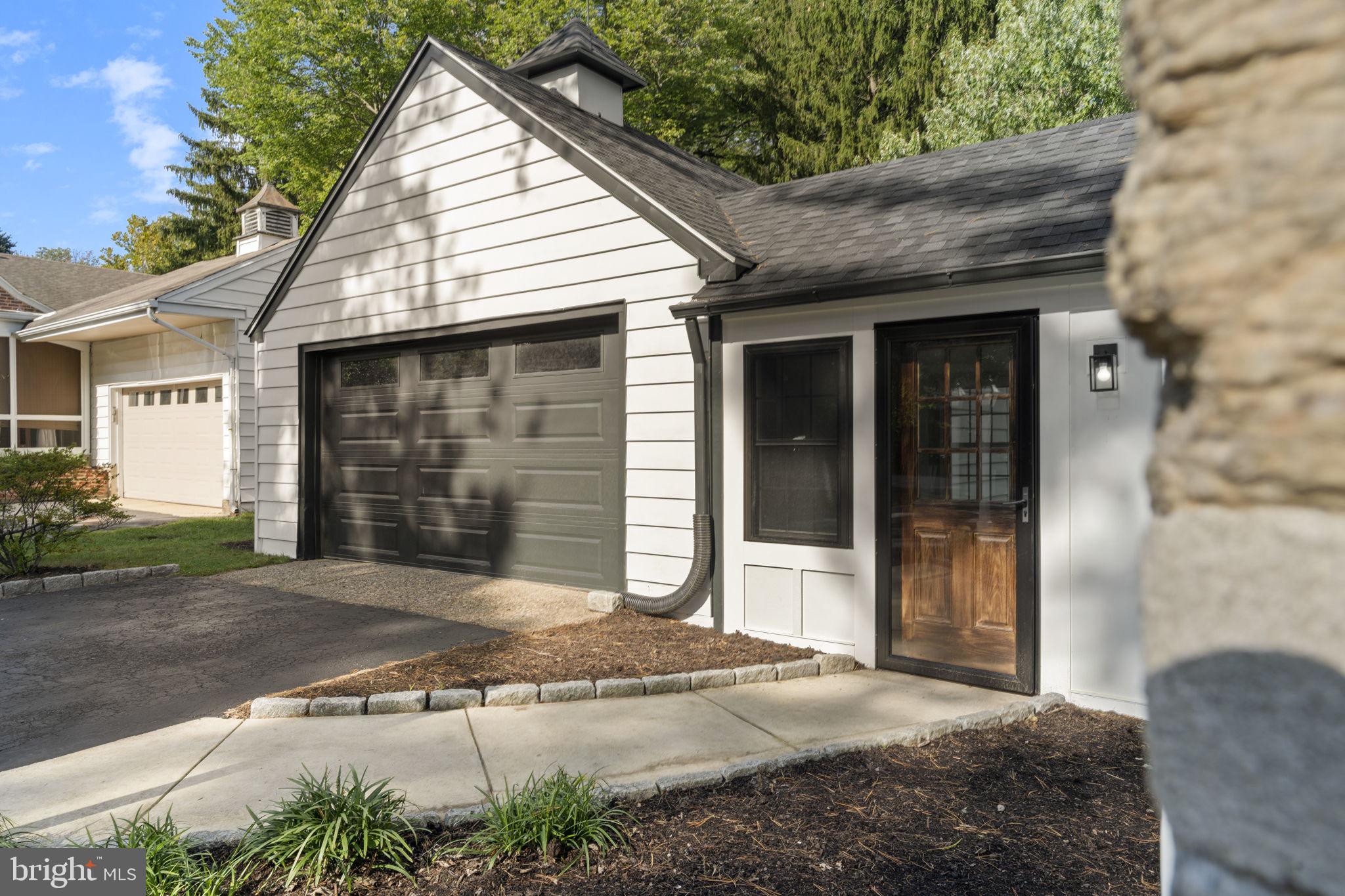 218 Engle Drive Wallingford, PA 19086 - Photo 6 of 51 a front view of a house with a yard