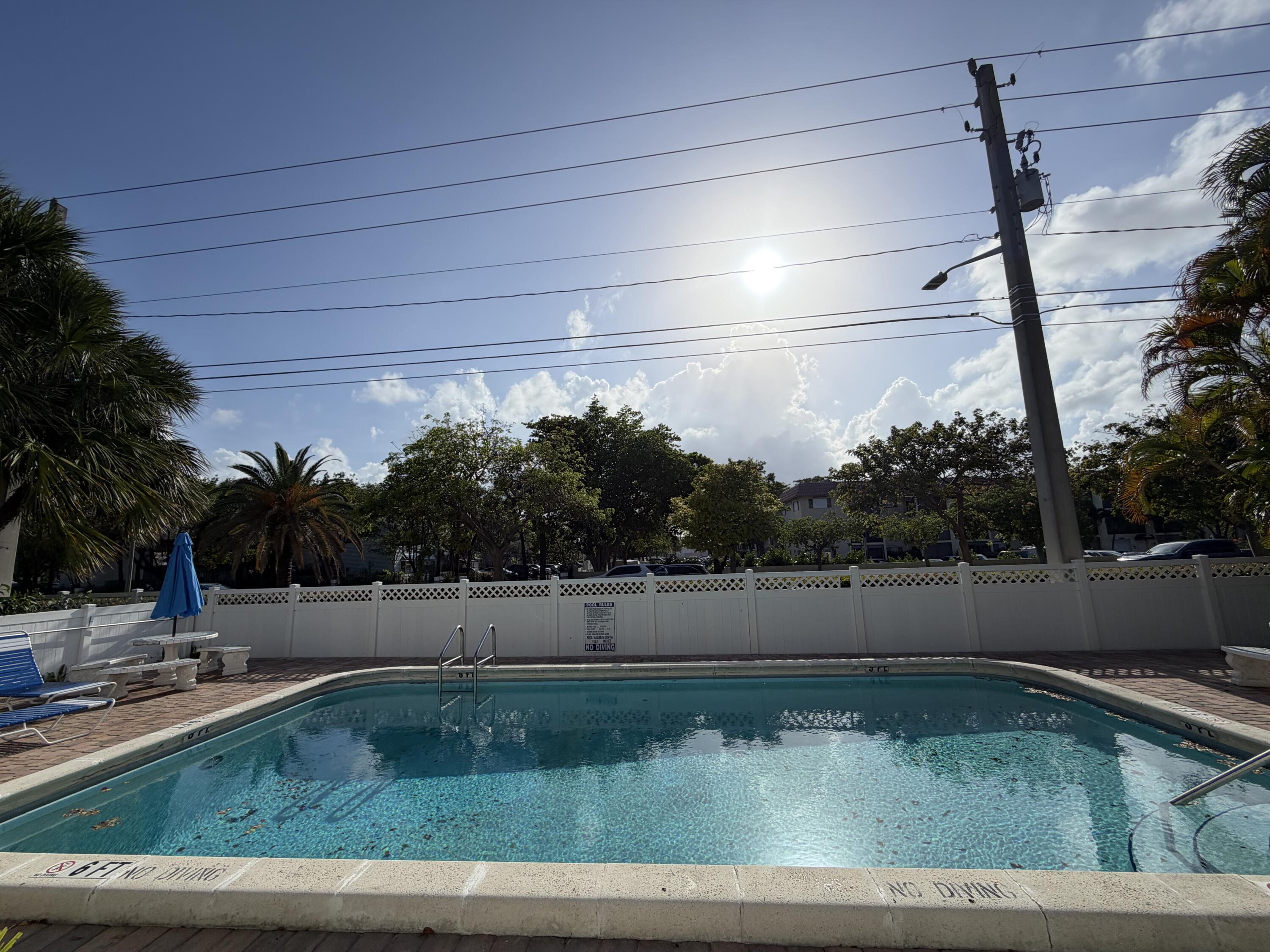 270 South Cypress Road, Unit 204 Pompano Beach, FL 33060 - Photo 1 of 14 a view of a backyard