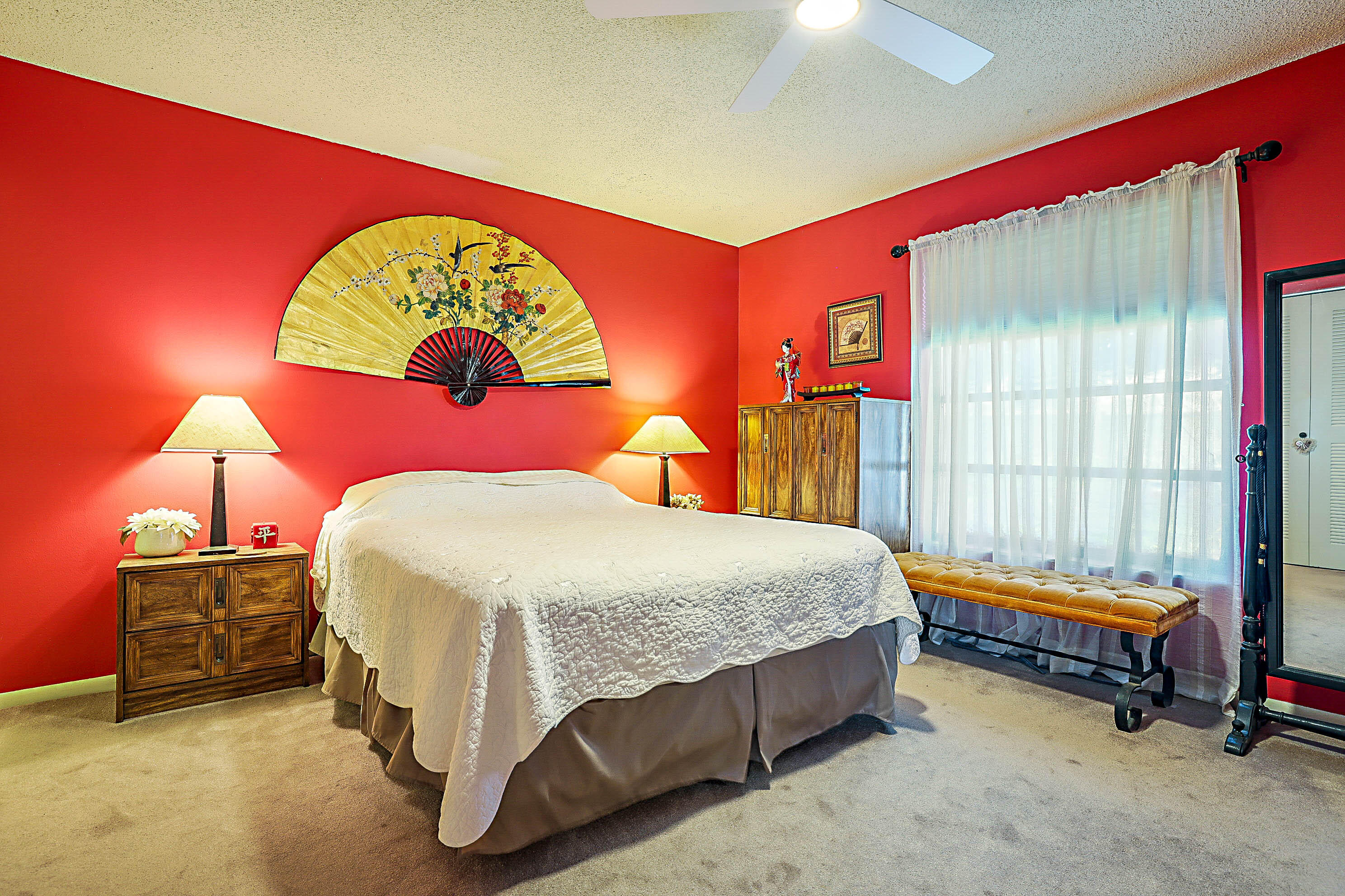 5231 Copperleaf Circle Delray Beach, FL 33484 - Photo 16 of 31 a bedroom with a bed and dresser next to a window