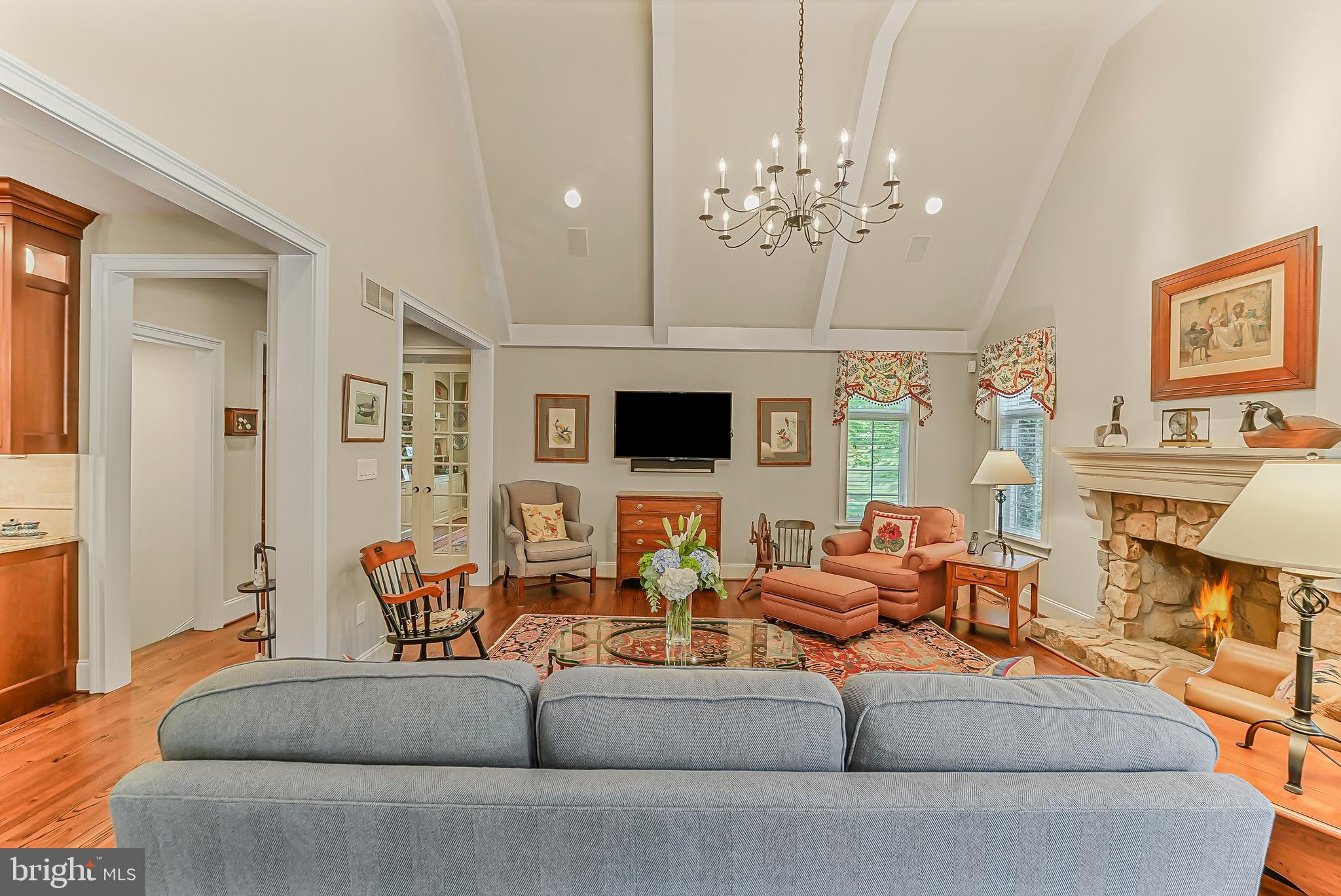 217 Valley Ridge Road Haverford, PA 19041 - Photo 17 of 49 a living room with fireplace furniture and a chandelier
