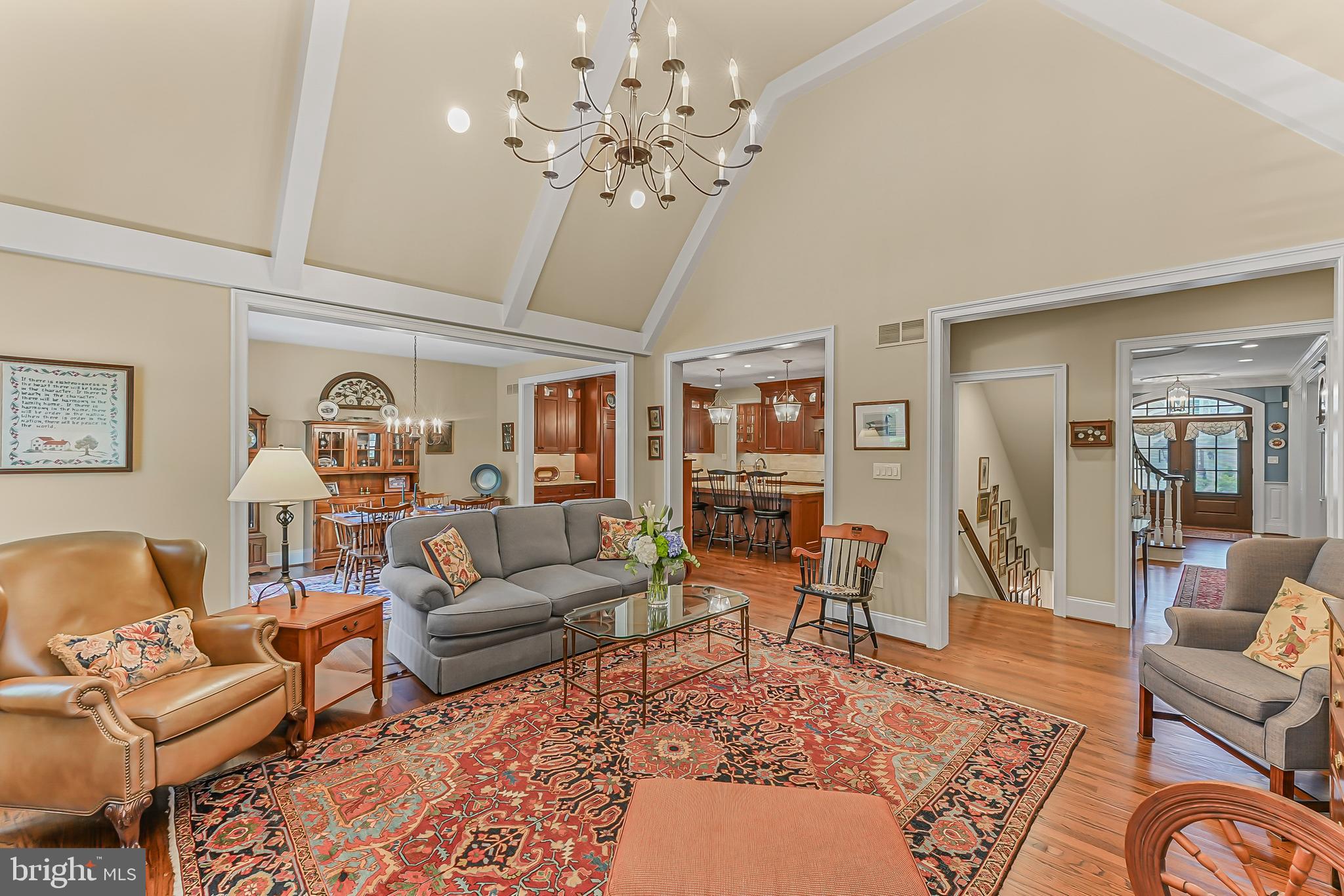 217 Valley Ridge Road Haverford, PA 19041 - Photo 19 of 49 a living room with furniture a chandelier and a rug