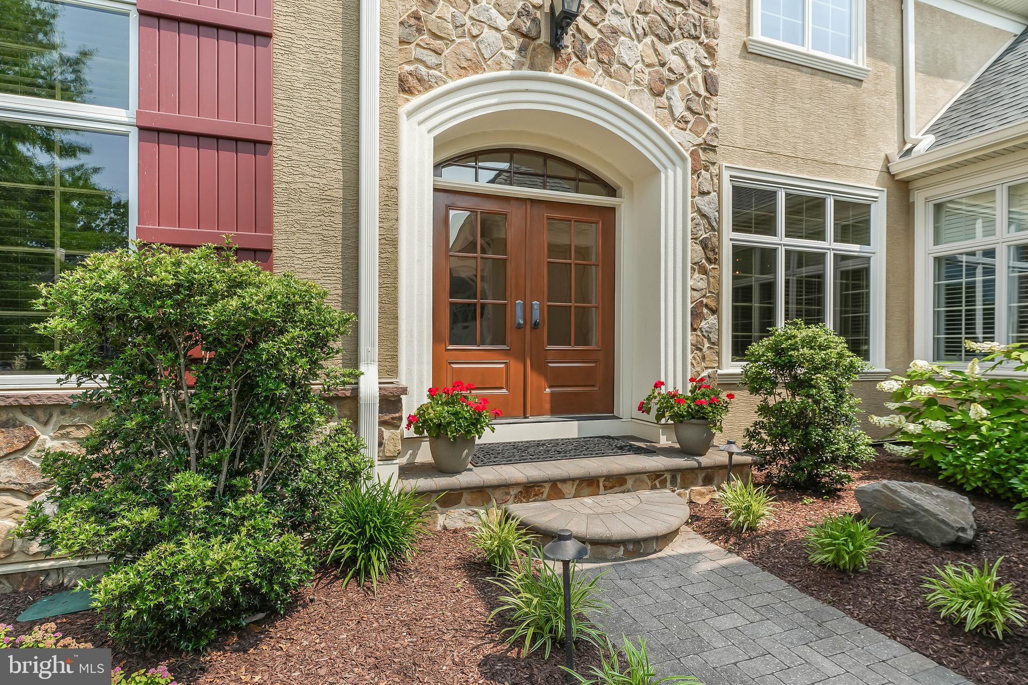 217 Valley Ridge Road Haverford, PA 19041 - Photo 2 of 49 a front view of a house with garden