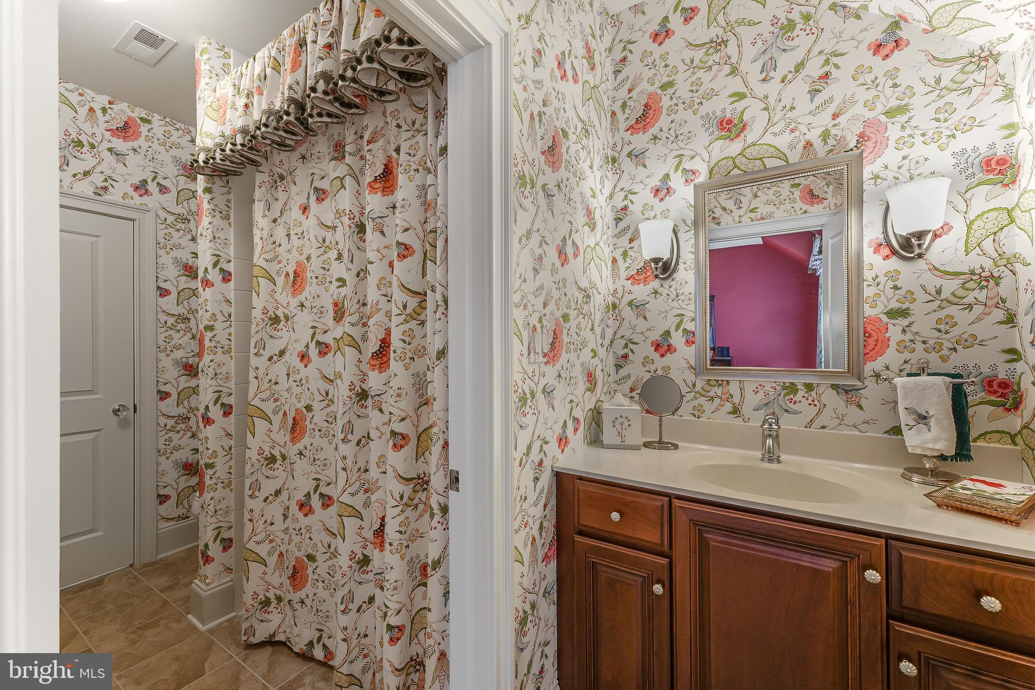 217 Valley Ridge Road Haverford, PA 19041 - Photo 31 of 49 a bathroom with a sink and a mirror