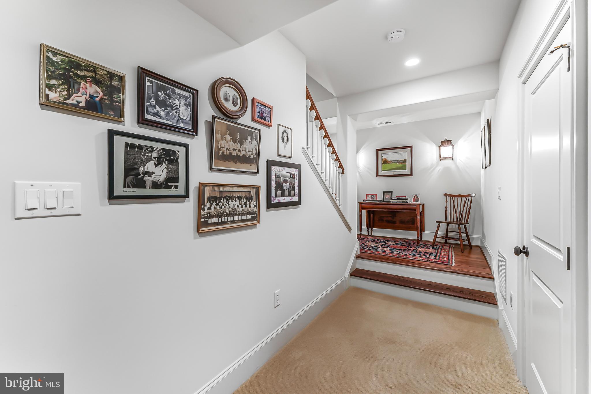 217 Valley Ridge Road Haverford, PA 19041 - Photo 38 of 49 a view of a hallway with paintings on the wall